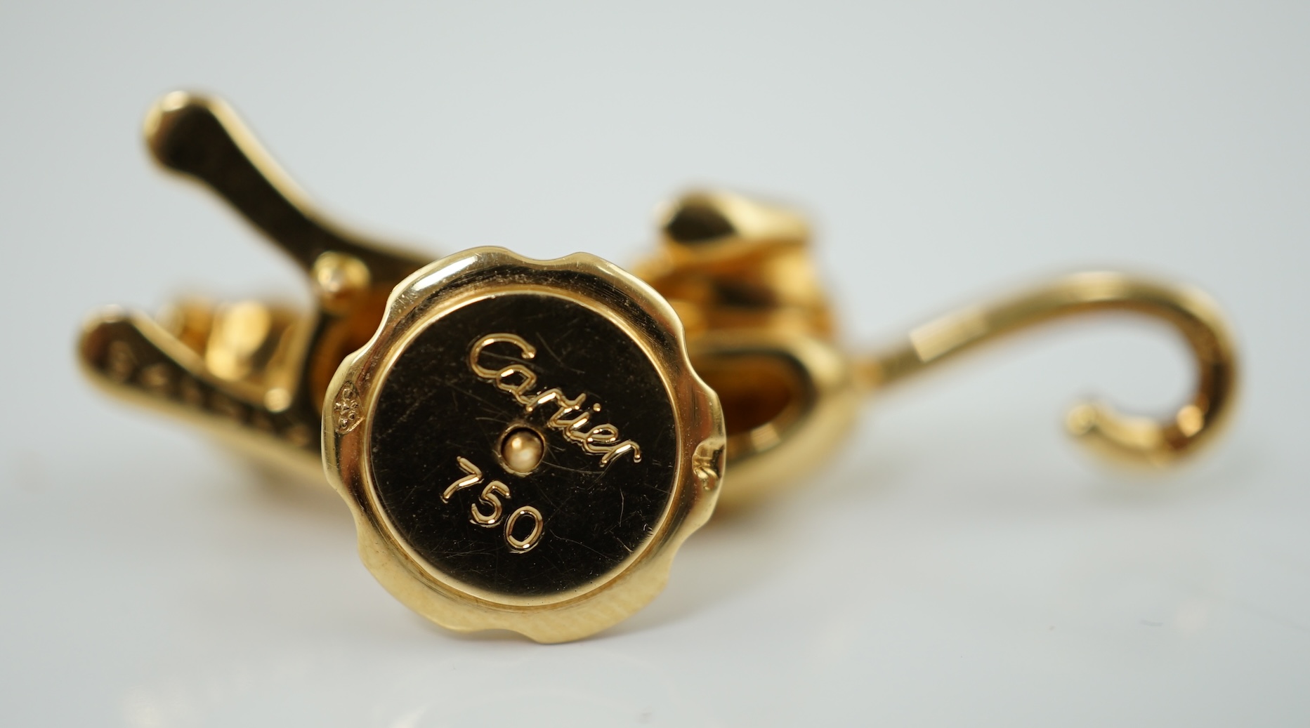 A late 1990's Cartier 18ct gold panther lapel pin